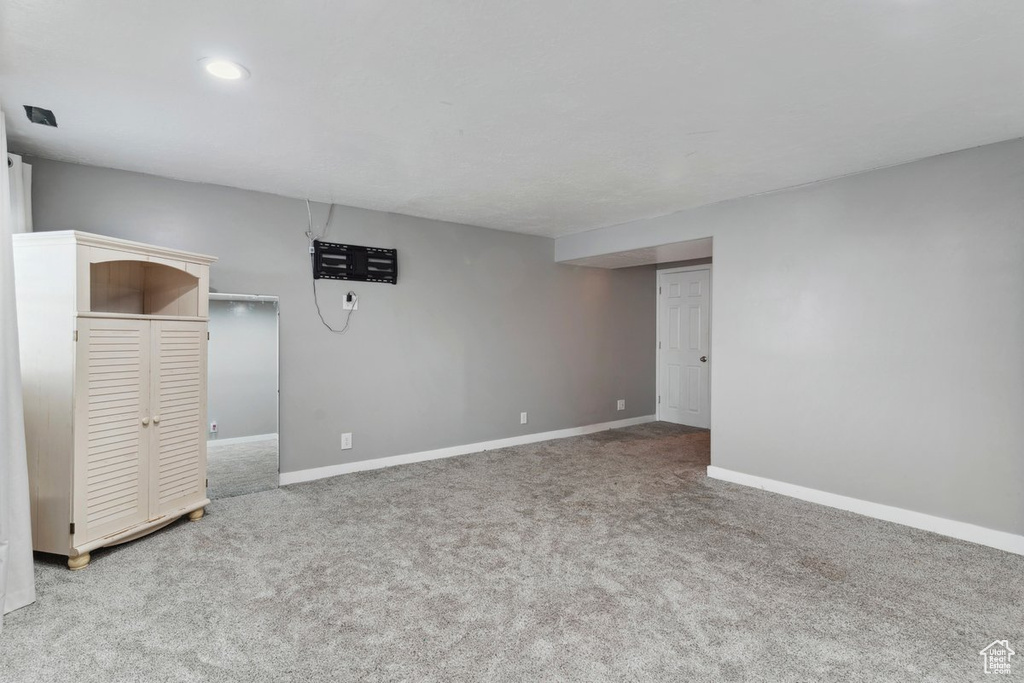 Finished basement featuring carpet and recessed lighting