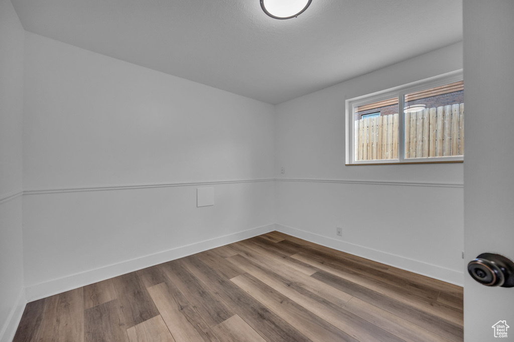 Unfurnished room with wood finished floors