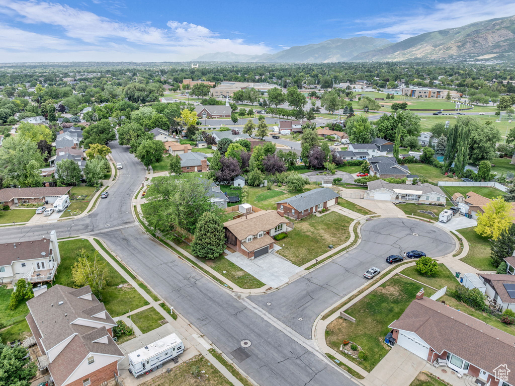 Aerial perspective of suburban area featuring a mountainous background