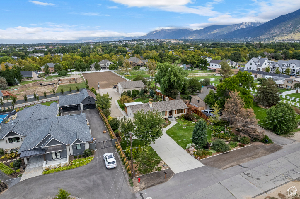 Aerial perspective of suburban area with a mountainous background