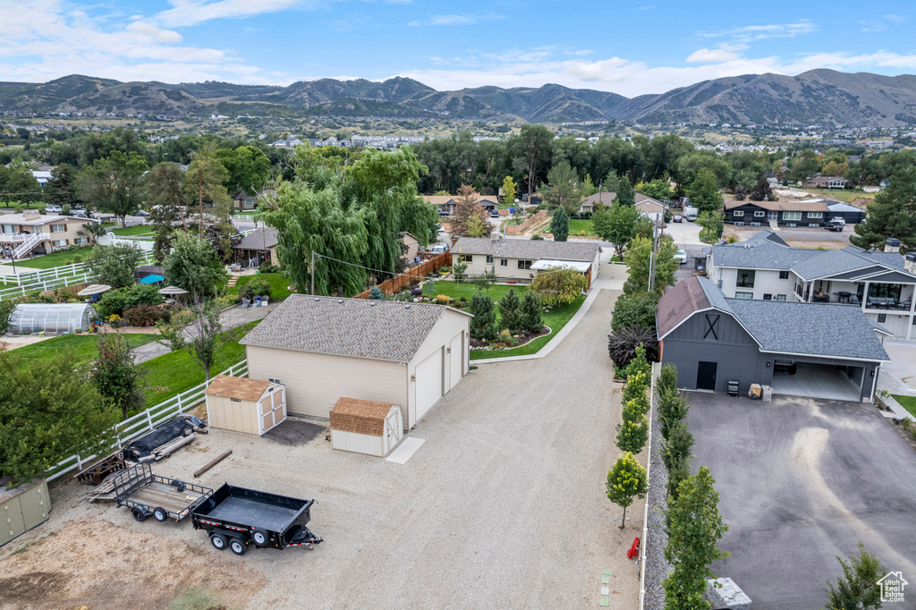 Aerial perspective of suburban area with a mountainous background