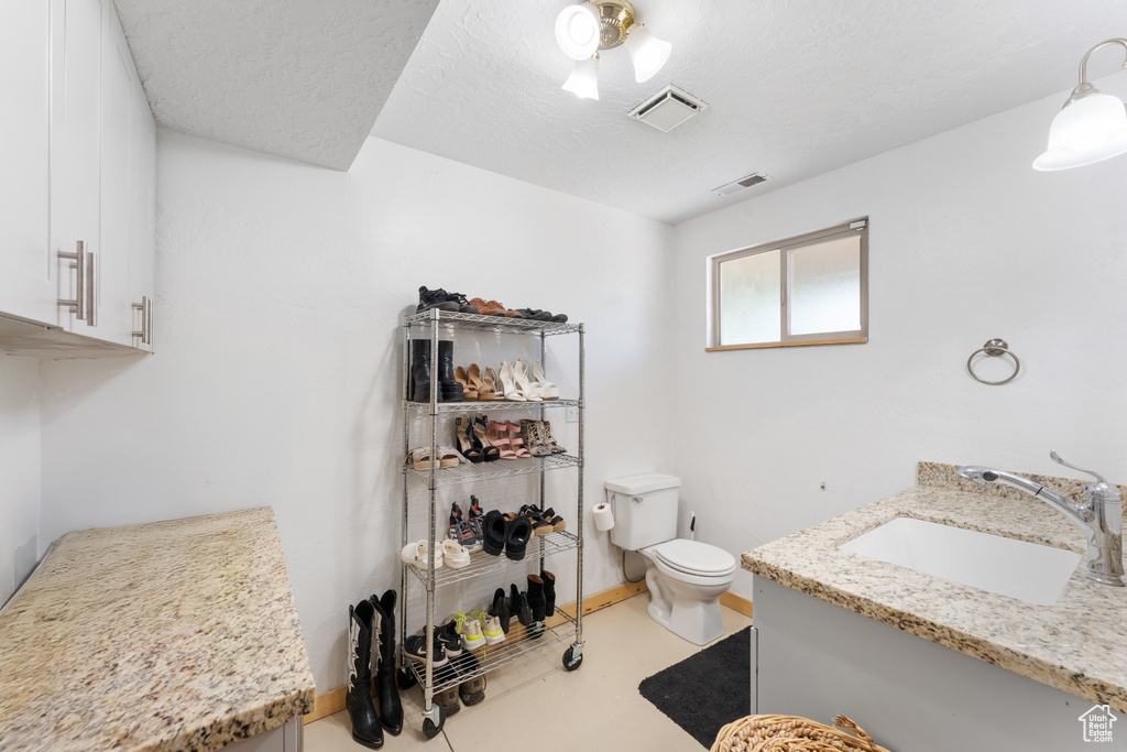 Bathroom with toilet and vanity