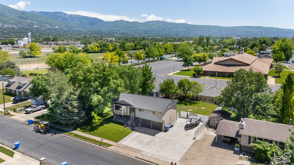 Aerial view of residential area featuring a mountain backdrop