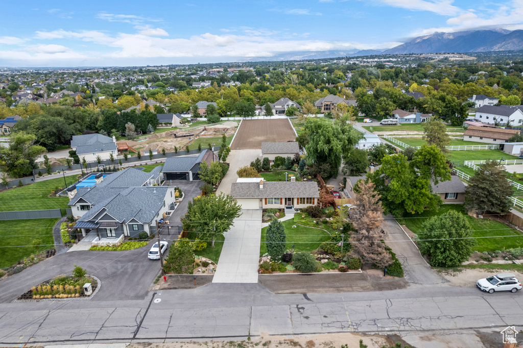 Aerial perspective of suburban area featuring a mountainous background