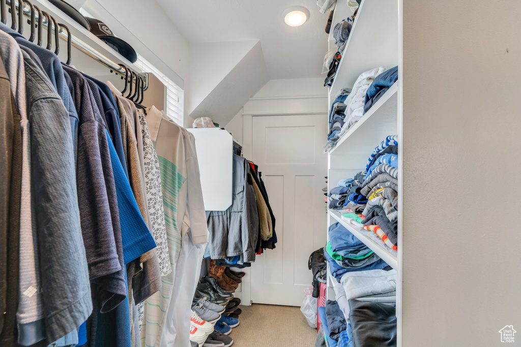 Spacious closet with carpet