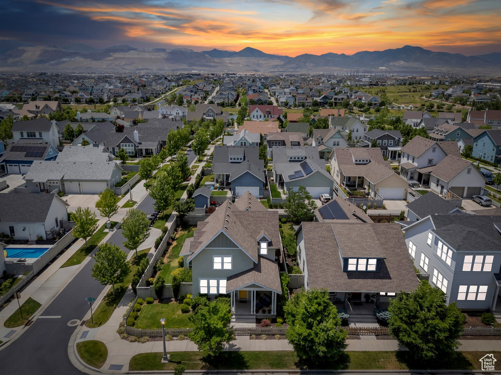 Aerial perspective of suburban area featuring a mountain backdrop