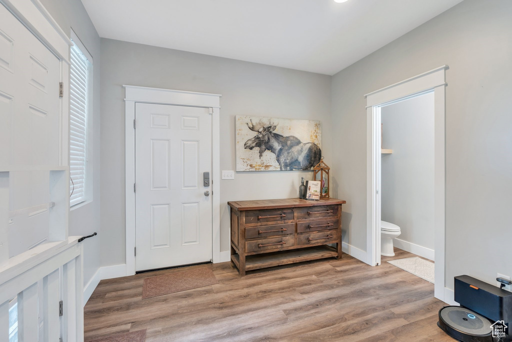 Foyer with light wood-style floors