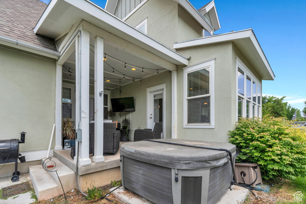 View of patio featuring a hot tub