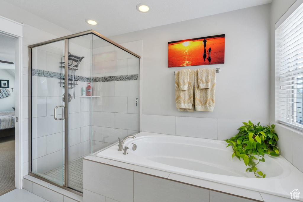 Full bath with a bath, a stall shower, recessed lighting, and ensuite bath