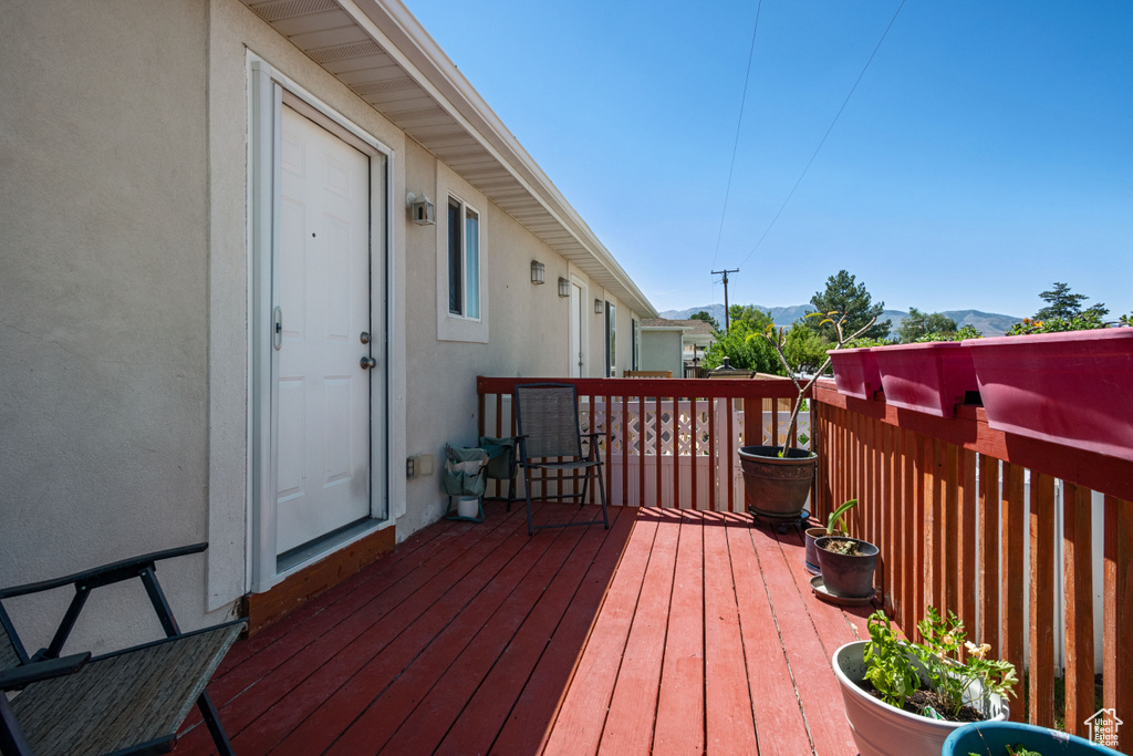 Wooden terrace featuring a mountain view
