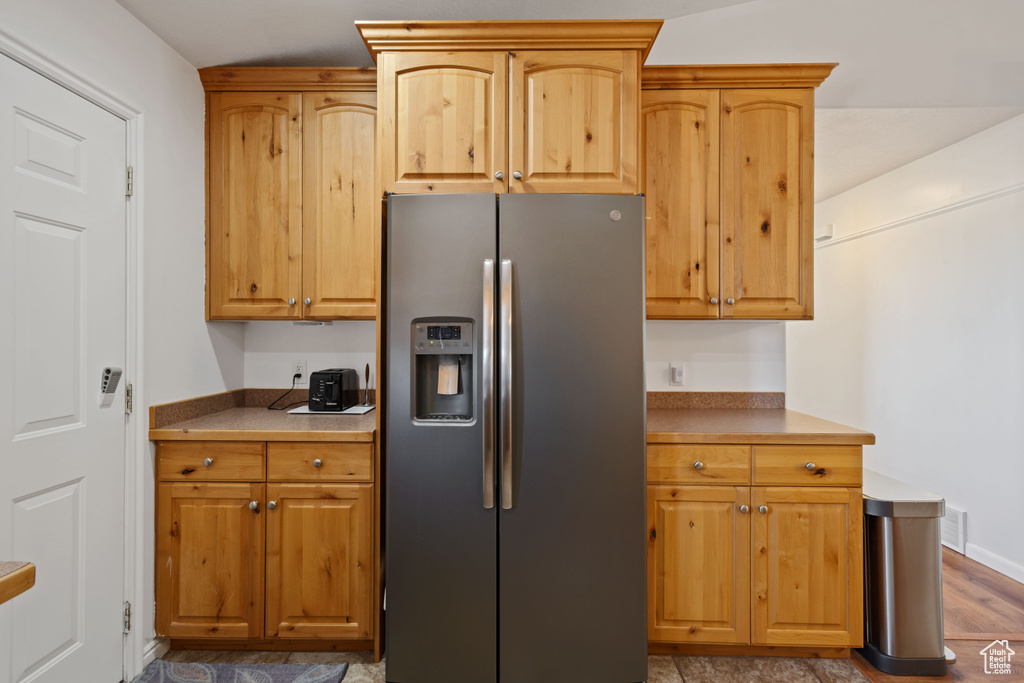 Kitchen with stainless steel fridge