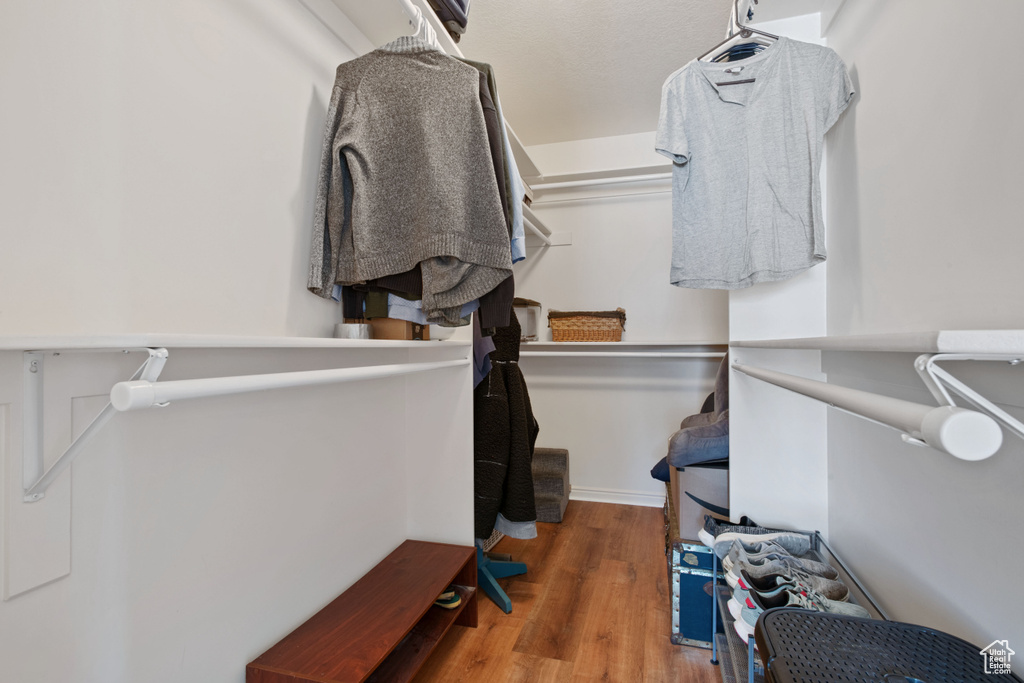 Walk in closet featuring wood finished floors