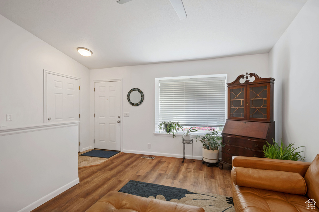 Entrance foyer featuring wood finished floors and baseboards