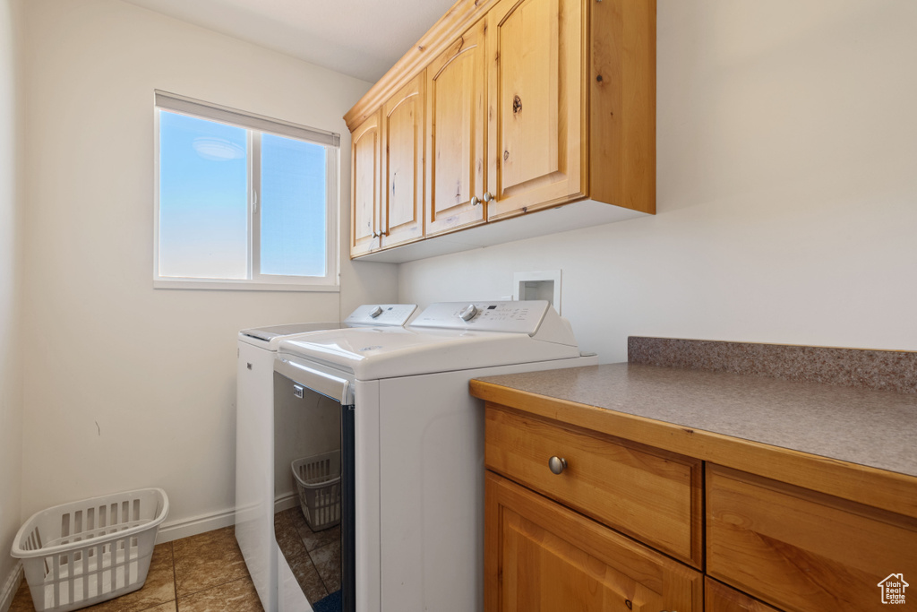 Laundry room featuring cabinet space and washer and dryer