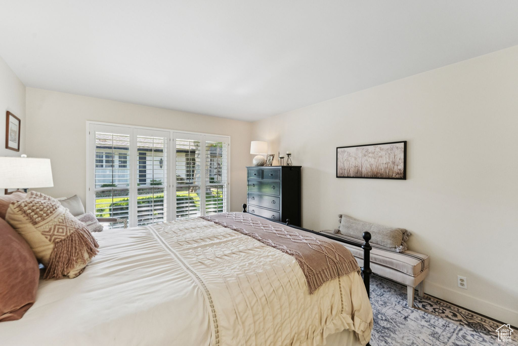Carpeted bedroom with access to exterior