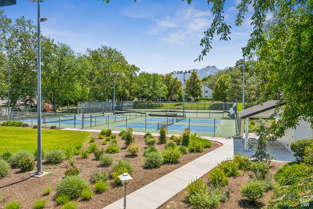 View of tennis court featuring a mountain view