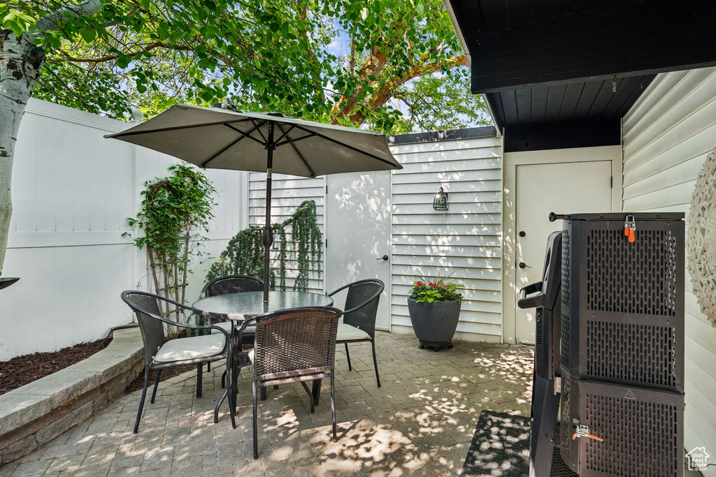 View of patio with outdoor dining area