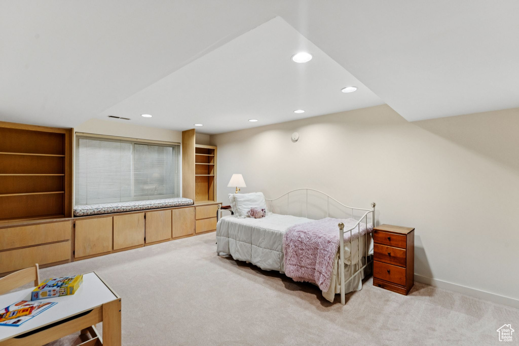 Bedroom featuring light carpet, recessed lighting, and baseboards