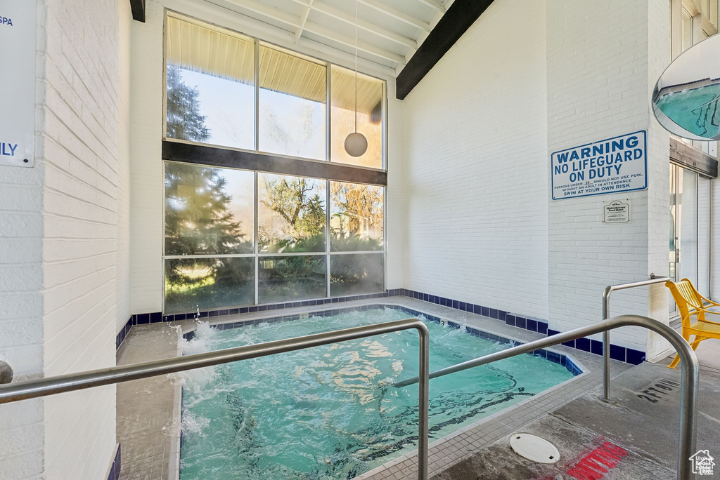 View of pool with a community hot tub