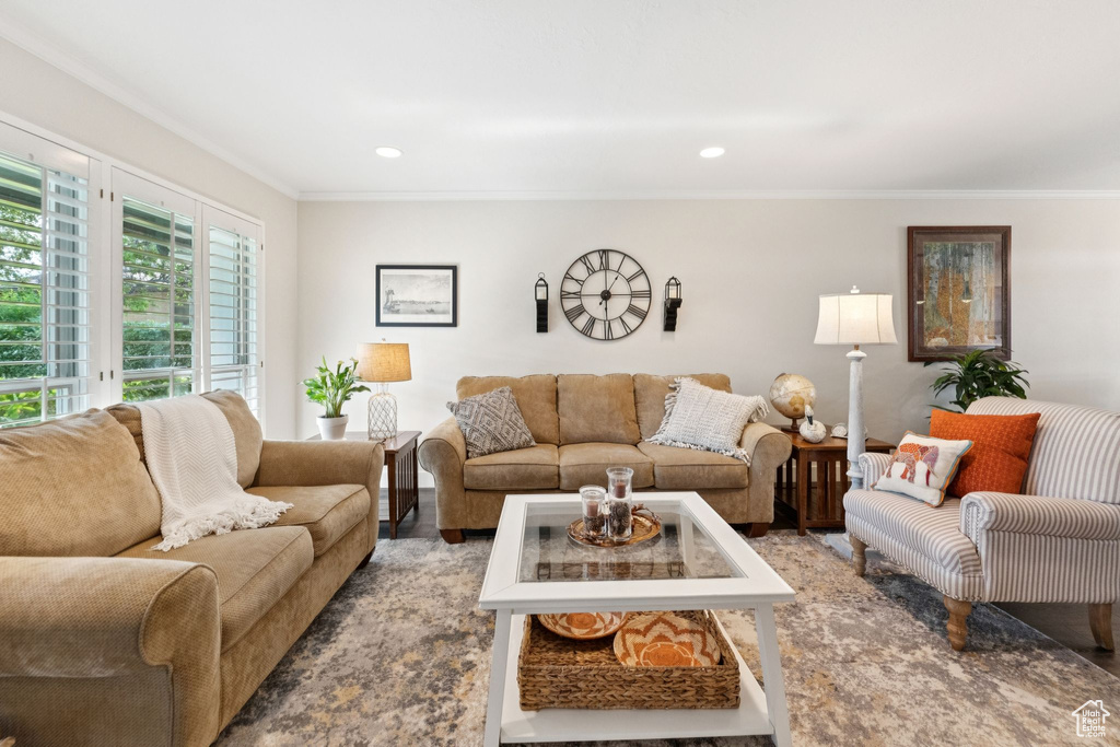 Living room with crown molding and recessed lighting
