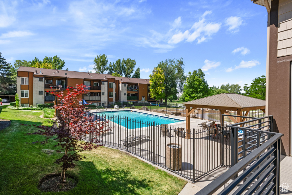 Community pool featuring a gazebo and a patio