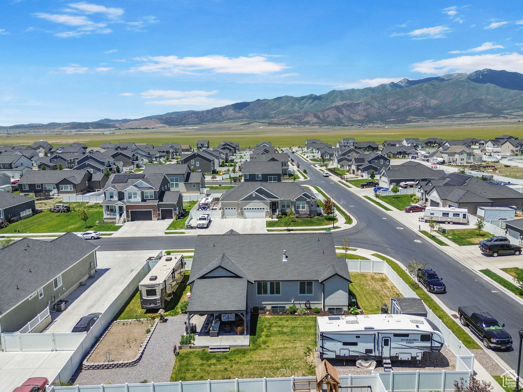 Aerial perspective of suburban area featuring a mountain backdrop