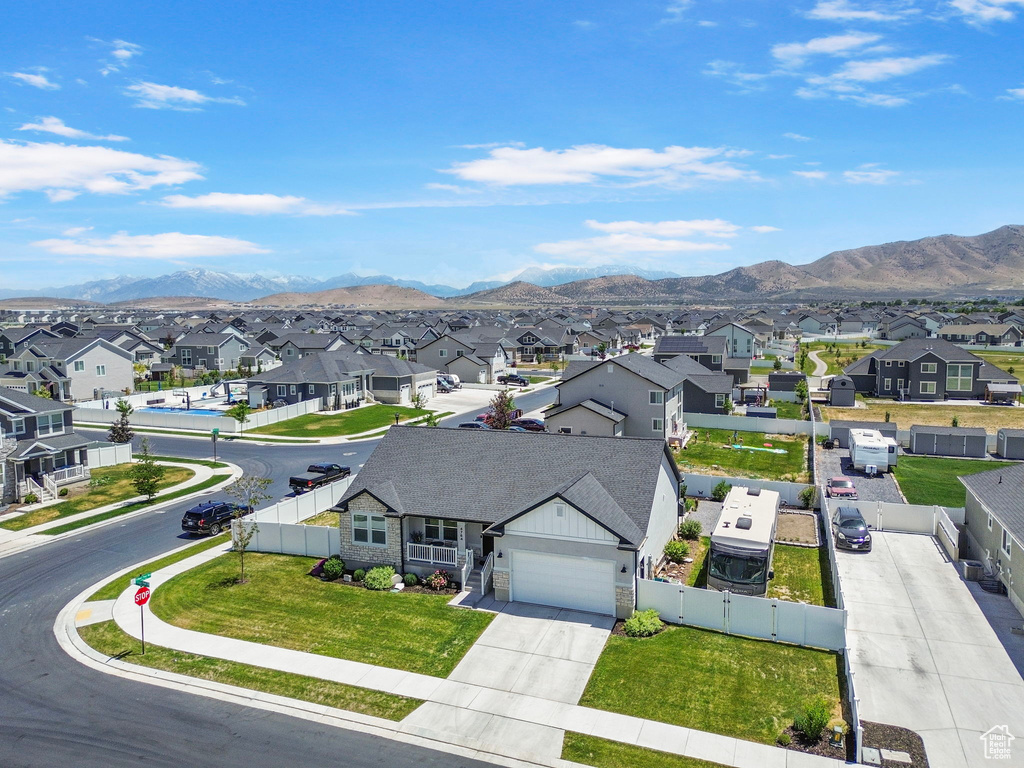 Aerial perspective of suburban area with a mountain backdrop