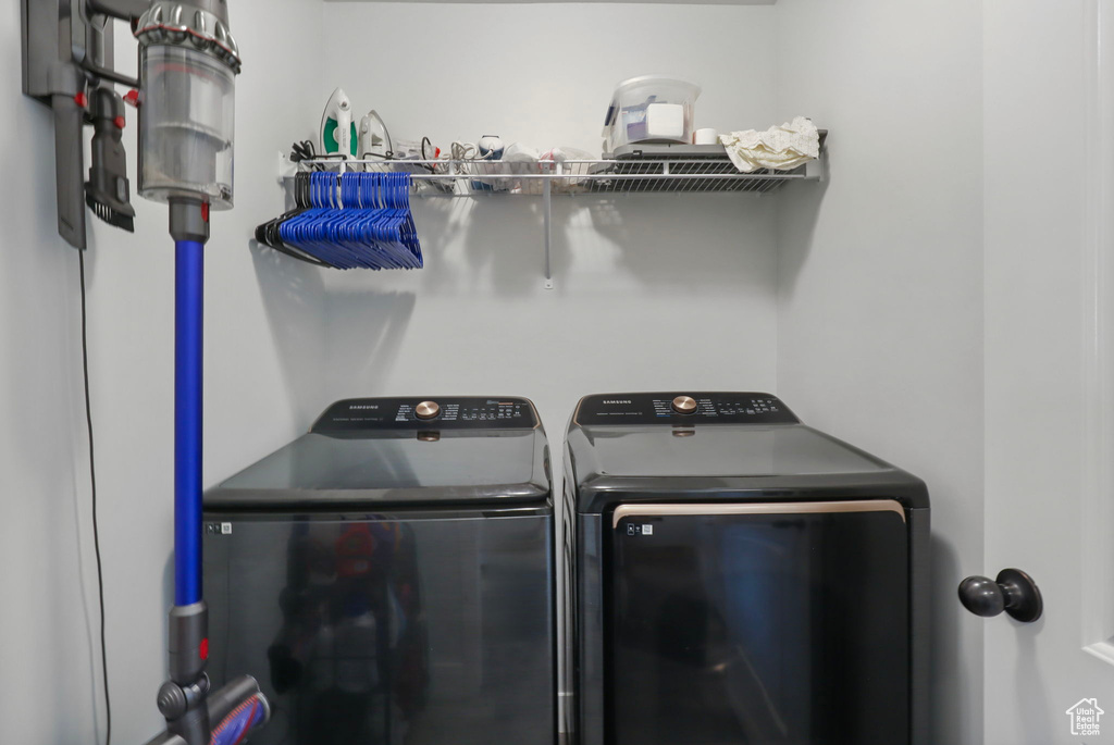 Laundry room with washer and clothes dryer