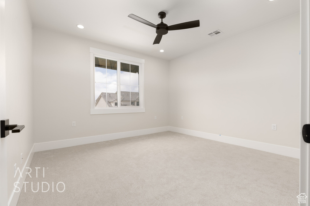 Unfurnished room featuring ceiling fan, light colored carpet, recessed lighting, and baseboards