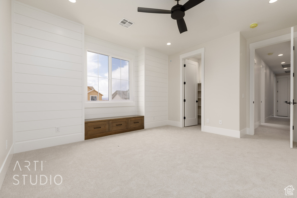 Unfurnished bedroom with light carpet, recessed lighting, baseboards, and a ceiling fan