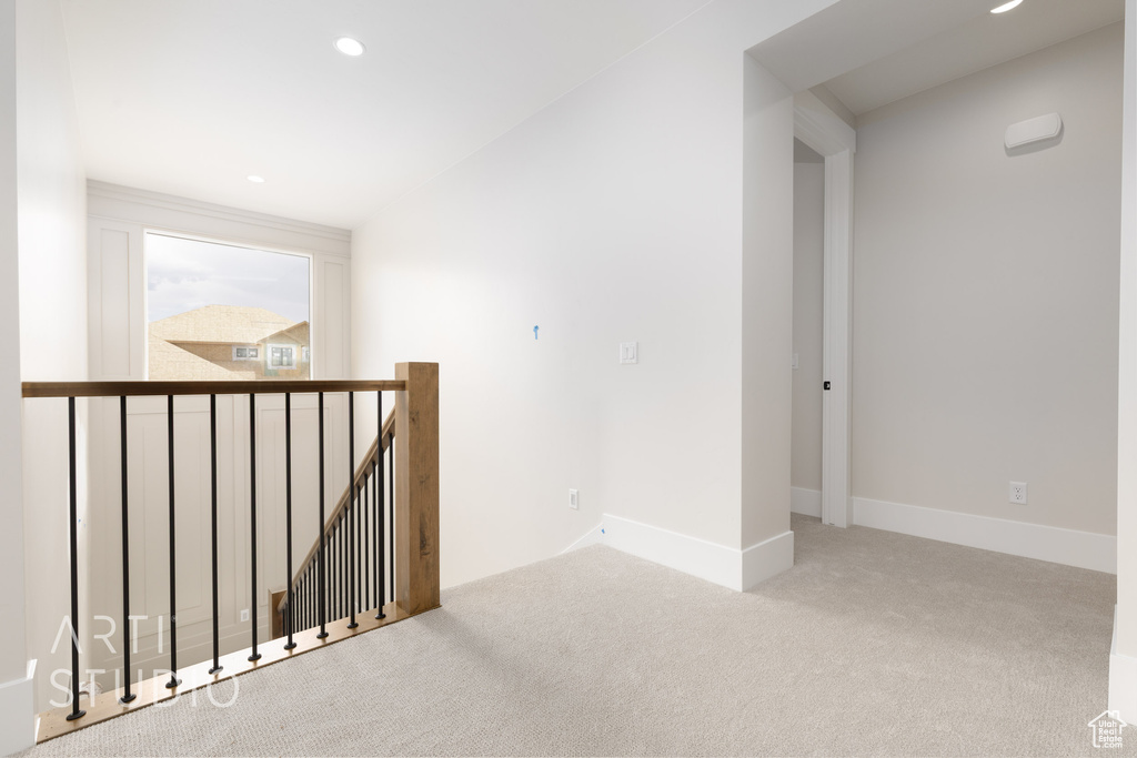Spare room with carpet flooring, recessed lighting, and baseboards