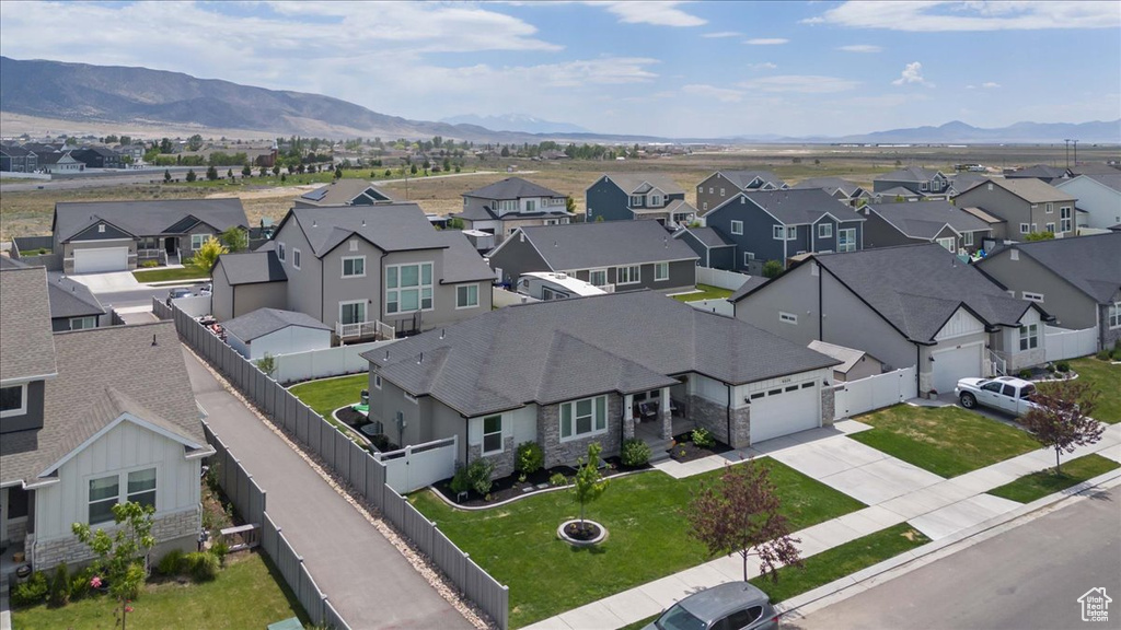 Aerial view of residential area featuring a mountain backdrop