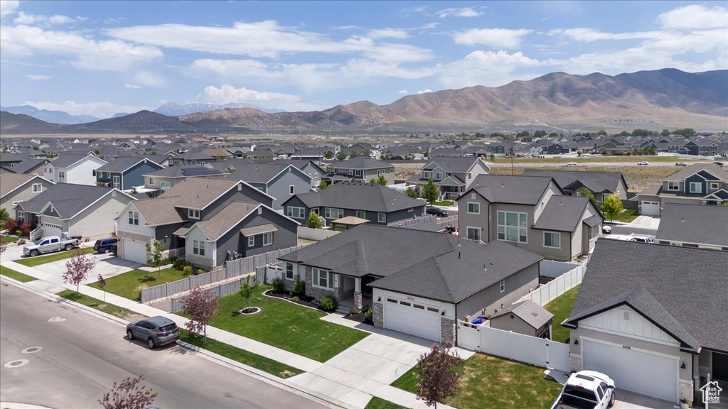Aerial perspective of suburban area with a mountainous background