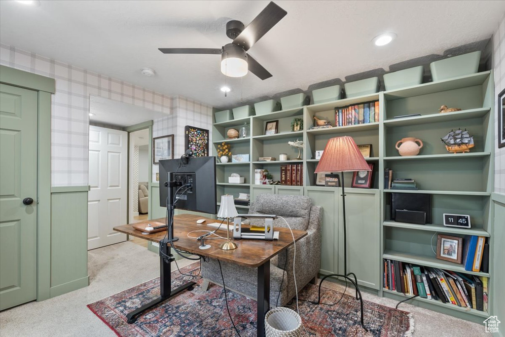 Office featuring carpet flooring, wallpapered walls, and a ceiling fan