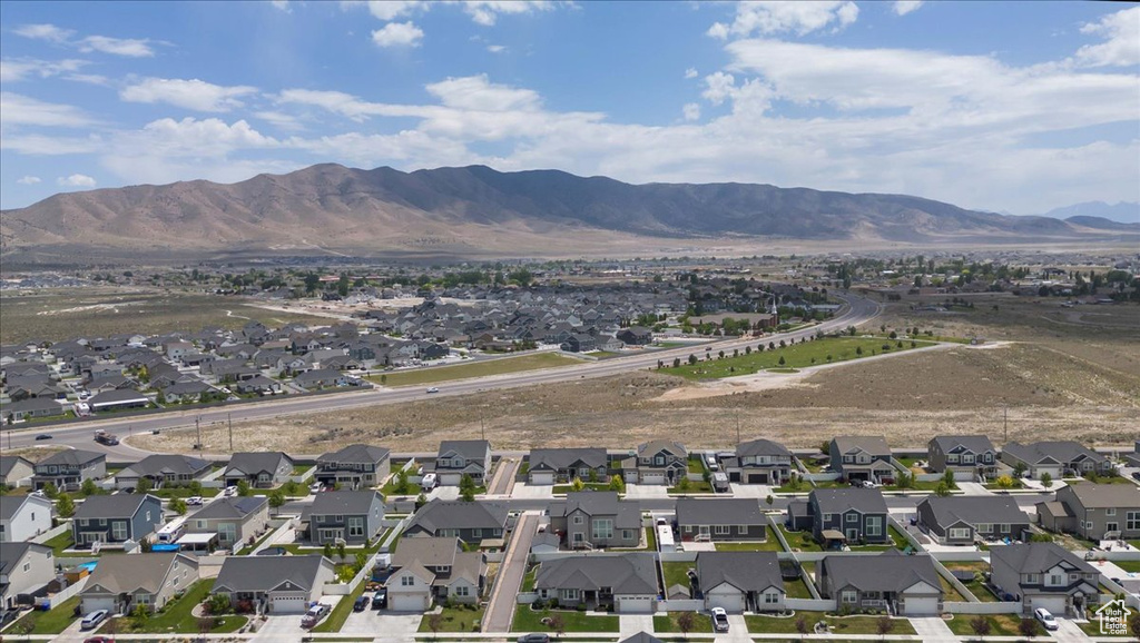 Aerial view of residential area featuring a mountain backdrop