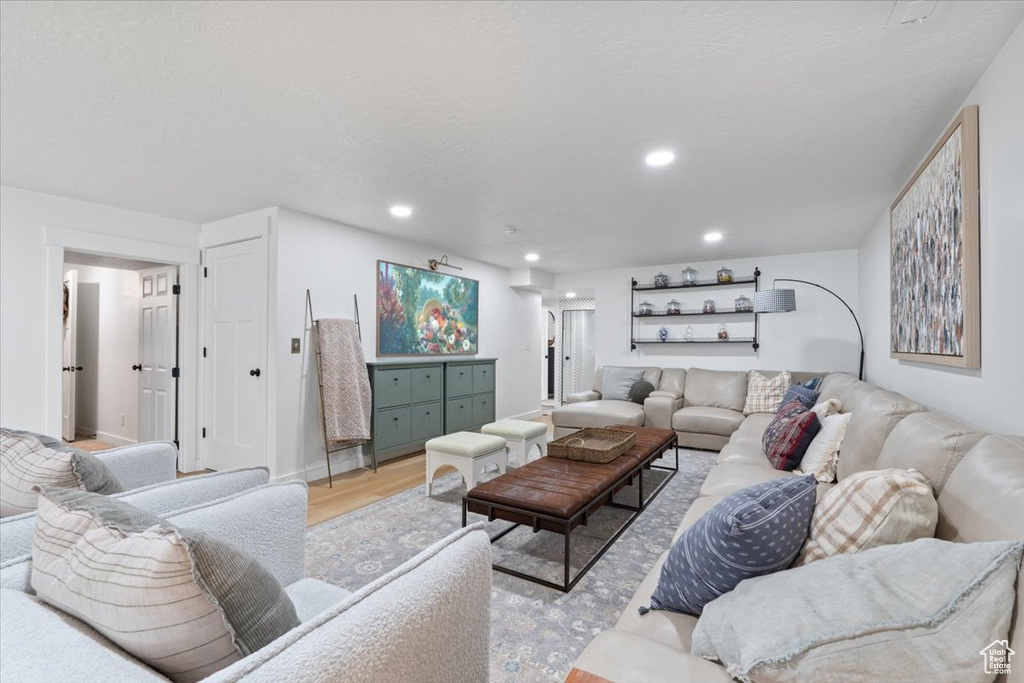 Living room featuring wood finished floors and recessed lighting