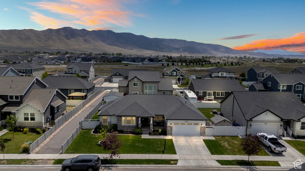 Aerial perspective of suburban area with a mountainous background