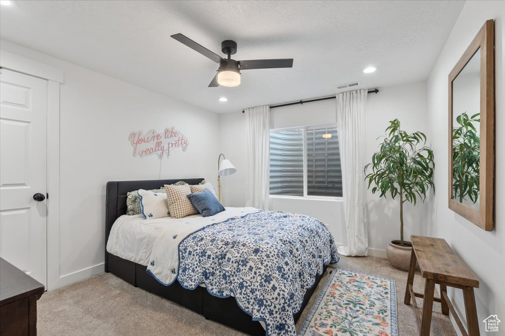 Bedroom featuring carpet, recessed lighting, and a ceiling fan