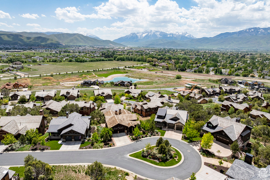 Aerial perspective of suburban area featuring a water and mountain view