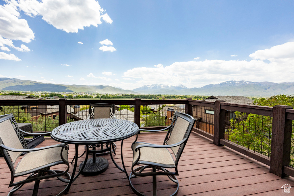 Wooden terrace featuring a mountain view