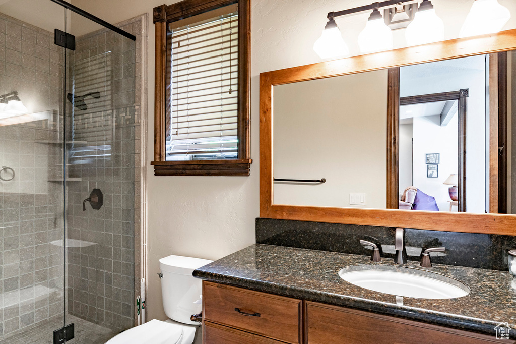 Bathroom with vanity and a stall shower