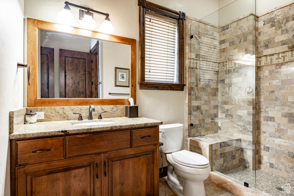 Bathroom with vanity and a stall shower