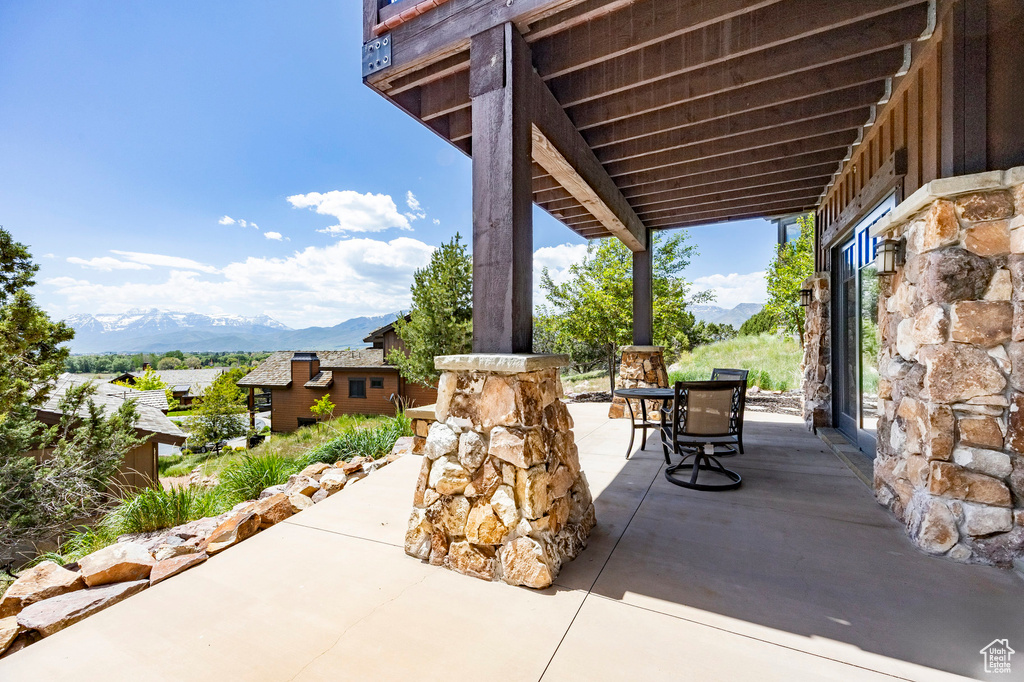 View of patio featuring a mountain view and outdoor dining space