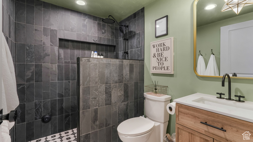 Full bathroom featuring walk in shower, vanity, and recessed lighting