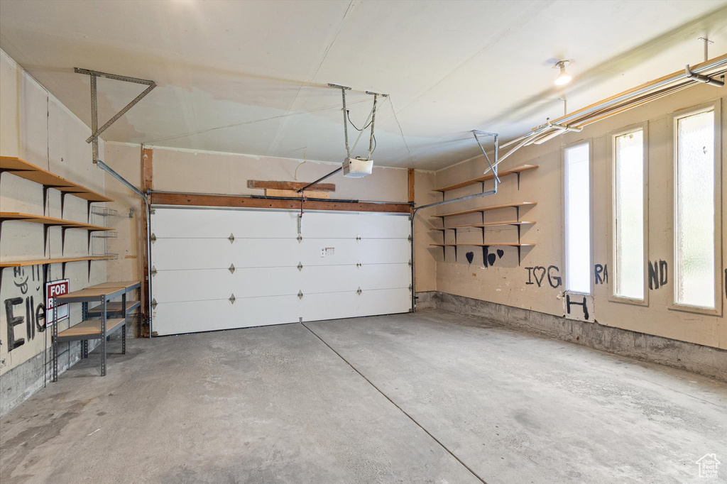 Garage featuring a garage door opener