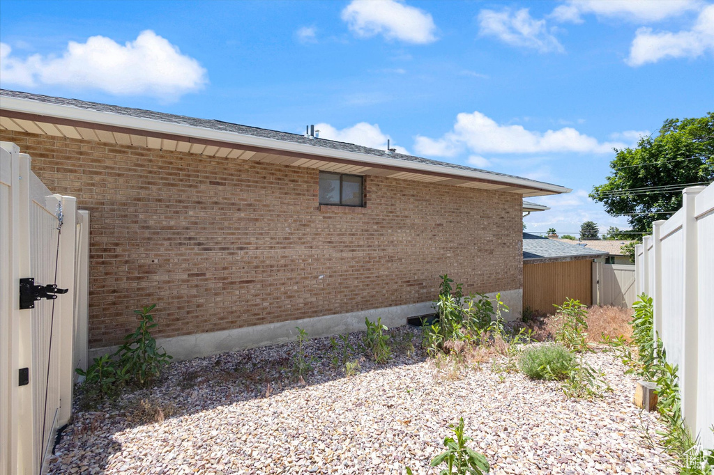 View of side of home with brick siding