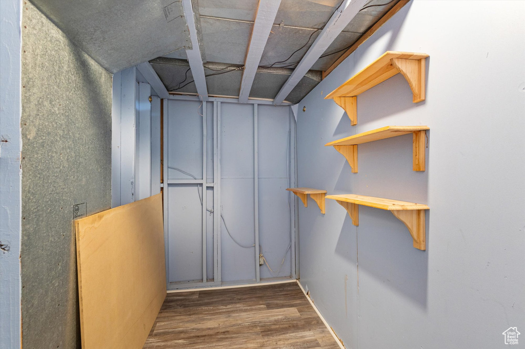 Basement featuring wood finished floors