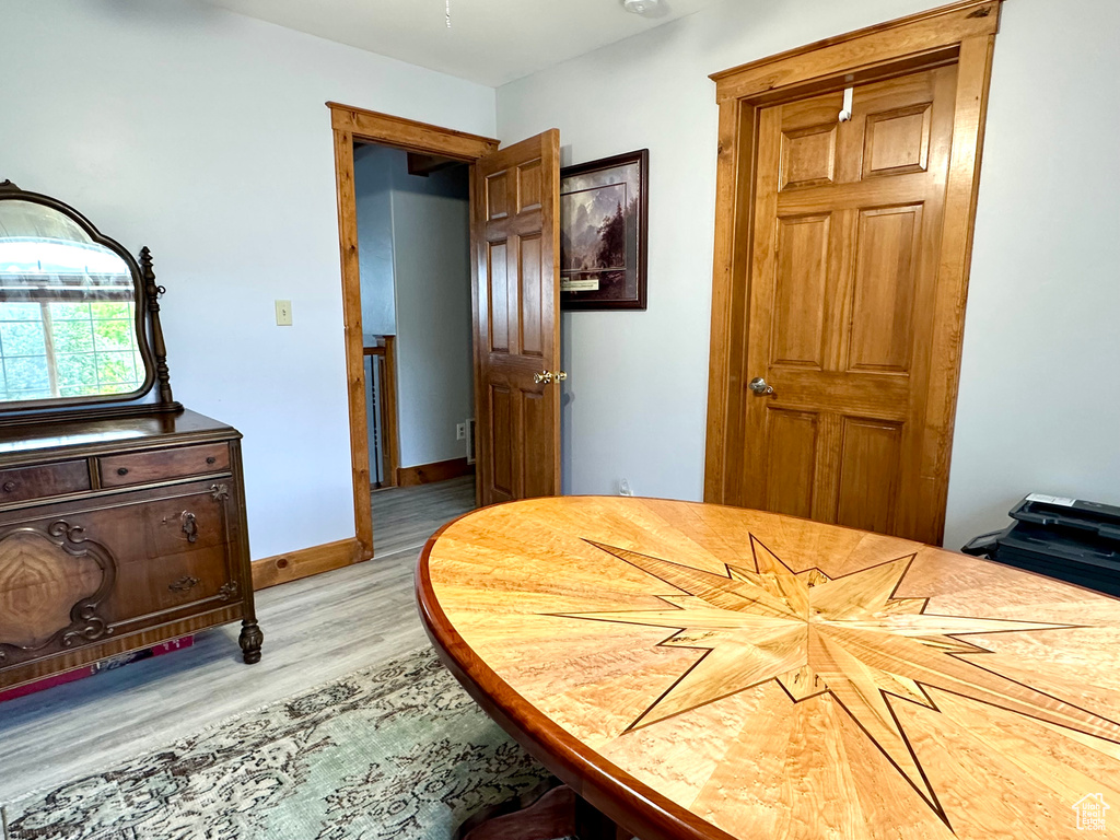 Bedroom featuring light wood-type flooring and baseboards