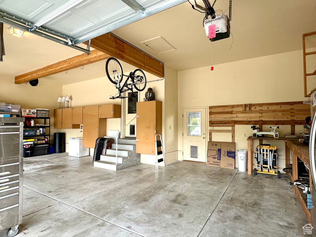 Garage featuring a garage door opener