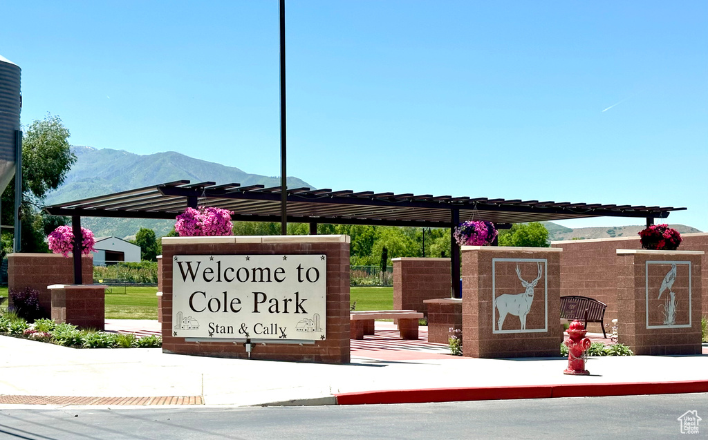Community sign with a mountain view